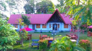 a small white house with a red roof at Orient Hotel in Bandarawela