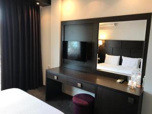 Postel nebo postele na pokoji v ubytování Hotel Kardinal