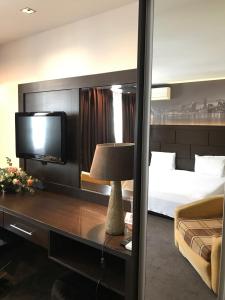 Postel nebo postele na pokoji v ubytování Hotel Kardinal
