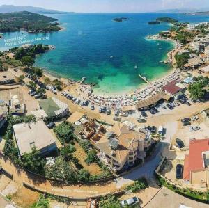 an aerial view of a resort with a beach and the ocean at Villa Xristos Kalogeris in Ksamil