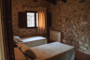 Кровать или кровати в номере Mas Puigdevall