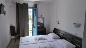 Postel nebo postele na pokoji v ubytování Delfini Hotel