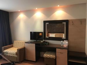 TV a/nebo společenská místnost v ubytování Hotel Kardinal