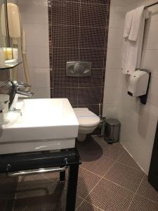 Koupelna v ubytování Hotel Kardinal