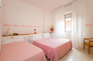Postel nebo postele na pokoji v ubytování Hotel Giongo