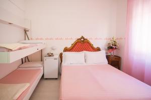 Postel nebo postele na pokoji v ubytování Hotel Giongo