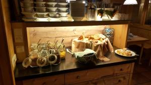 a table with bread and other food on it at Hotel Daimerwirt in Moosinning