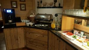 a kitchen with a counter with food on it at Hotel Daimerwirt in Moosinning