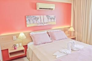 Een bed of bedden in een kamer bij Residence Kariri Beach Cumbuco