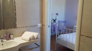 Postel nebo postele na pokoji v ubytování B&B Il Paiolo