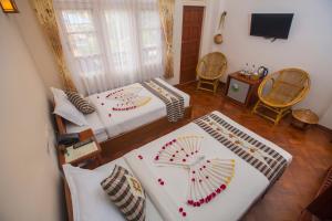 Vuode tai vuoteita majoituspaikassa Inle Apex Hotel