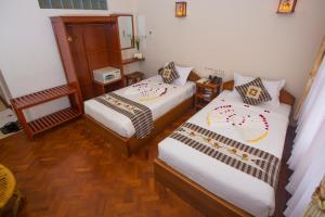 Vuode tai vuoteita majoituspaikassa Inle Apex Hotel