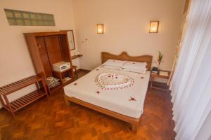 Vuode tai vuoteita majoituspaikassa Inle Apex Hotel