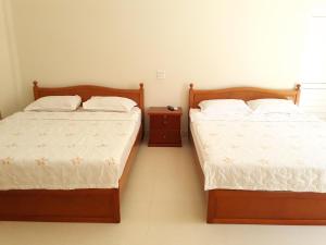 Postel nebo postele na pokoji v ubytování Ngoc Sang Guesthouse