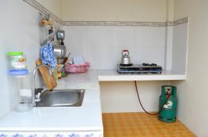 Kuchyň nebo kuchyňský kout v ubytování Ngoc Sang Guesthouse + 30 fotografií