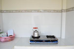 Kuchyň nebo kuchyňský kout v ubytování Ngoc Sang Guesthouse