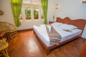 Vuode tai vuoteita majoituspaikassa Inle Apex Hotel