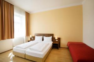 Rúm í herbergi á Hahn Hotel Vienna