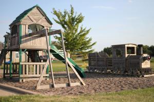a small playground with a train on a slide at Depot Inn & Suites in La Plata