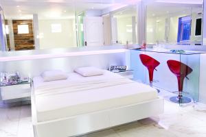 Postel nebo postele na pokoji v ubytování MOTEL LIBIDUS - Foz do Iguaçu