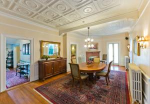 a dining room with a table and chairs at The Elmhurst Inn in Bar Harbor