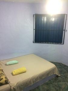 En eller flere senge i et værelse på Casa Canal em Cabo Frio