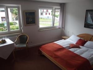 Postel nebo postele na pokoji v ubytování Hotel Pension Café Hasler