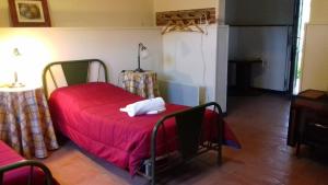 Un pat sau paturi într-o cameră la Hotel de Montaña Estancia Niña Paula
