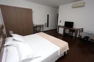 Postel nebo postele na pokoji v ubytování Hotel Schroeder