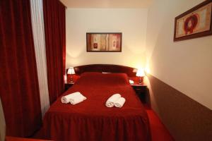 Voodi või voodid majutusasutuse Hotel Petrus toas