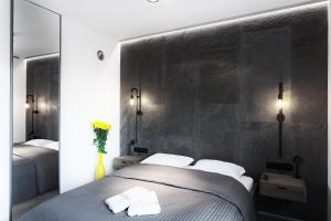 Posteľ alebo postele v izbe v ubytovaní Qbik Loft Aparts