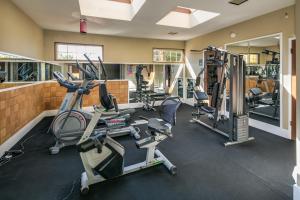 a gym with several exercise bikes and treadmills at Coachman Inn in Bellingham