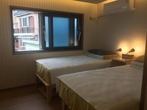 Postel nebo postele na pokoji v ubytování Guest House Dalggume