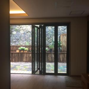 an open door with a view of a patio at Guest House Dalggume in Mokpo