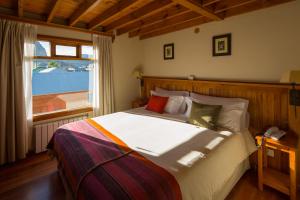 Un pat sau paturi într-o cameră la Hosteria Senderos