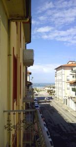 a balcony of a building with a view of the ocean at Casa Arsella in Viareggio