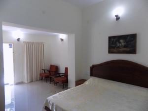 Postel nebo postele na pokoji v ubytování Safire Residency