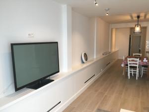 a living room with a flat screen tv on a wall at apartment Seaside in Blankenberge