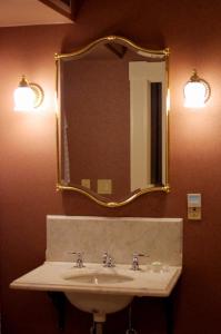 a bathroom with a sink and a mirror at Beaumont Hotel and Spa - Adults Only in Ouray