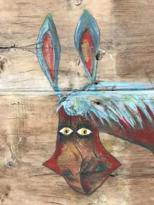 a painting of a chicken with horns on its head at Apartamentos La Selva in Cádiz +14 photos