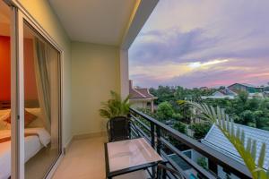 Postel nebo postele na pokoji v ubytování Golden Citadel Hotel Siem Reap + 34 fotografií