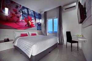 Voodi või voodid majutusasutuse favehotel Langko Mataram - Lombok toas