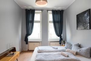 Una cama o camas en una habitación de Oskars Absteige