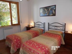 Posteľ alebo postele v izbe v ubytovaní Casa vacanza montecapino