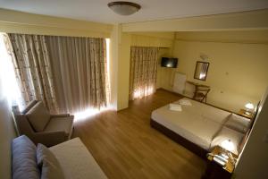 Voodi või voodid majutusasutuse Hotel Cronos toas