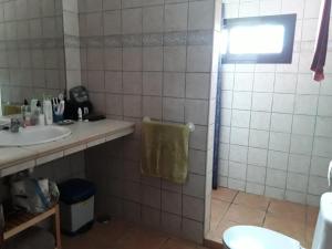 a bathroom with a sink and a shower at Blue Beach in Famara +29 photos