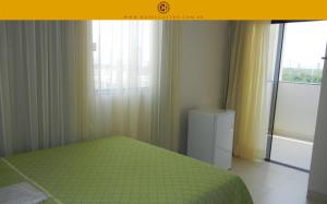Cama ou camas em um quarto em Hotel Castro