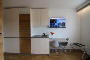 Kuchyň nebo kuchyňský kout v ubytování BA Hotel by WMM Hotels