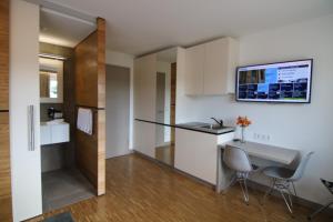 Kuchyň nebo kuchyňský kout v ubytování BA Hotel by WMM Hotels