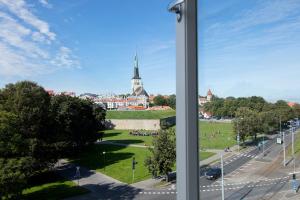 a view of a city from a window at Mere Puiestee Apartment in Tallinn